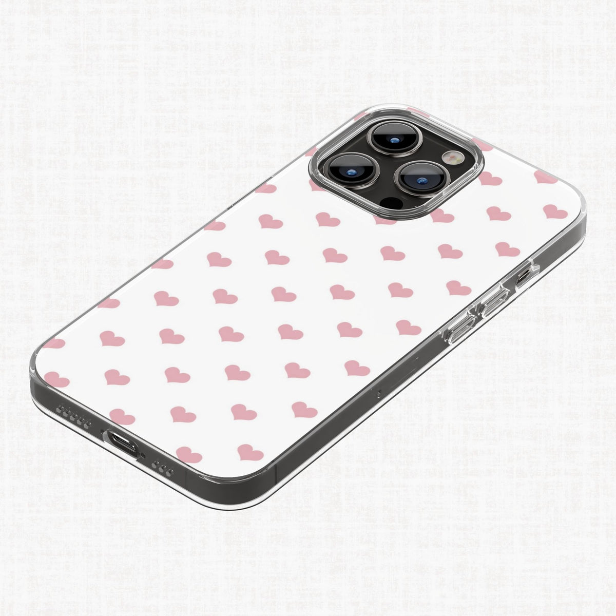 Blush pink heart pattern shown applied to a clear phone case as an example of a finished product design.
