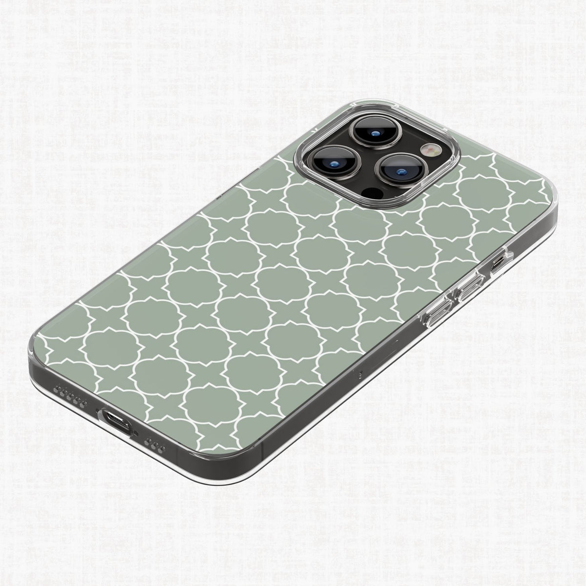 Sage green and white quatrefoil pattern shown on a phone case as a finished-product example.