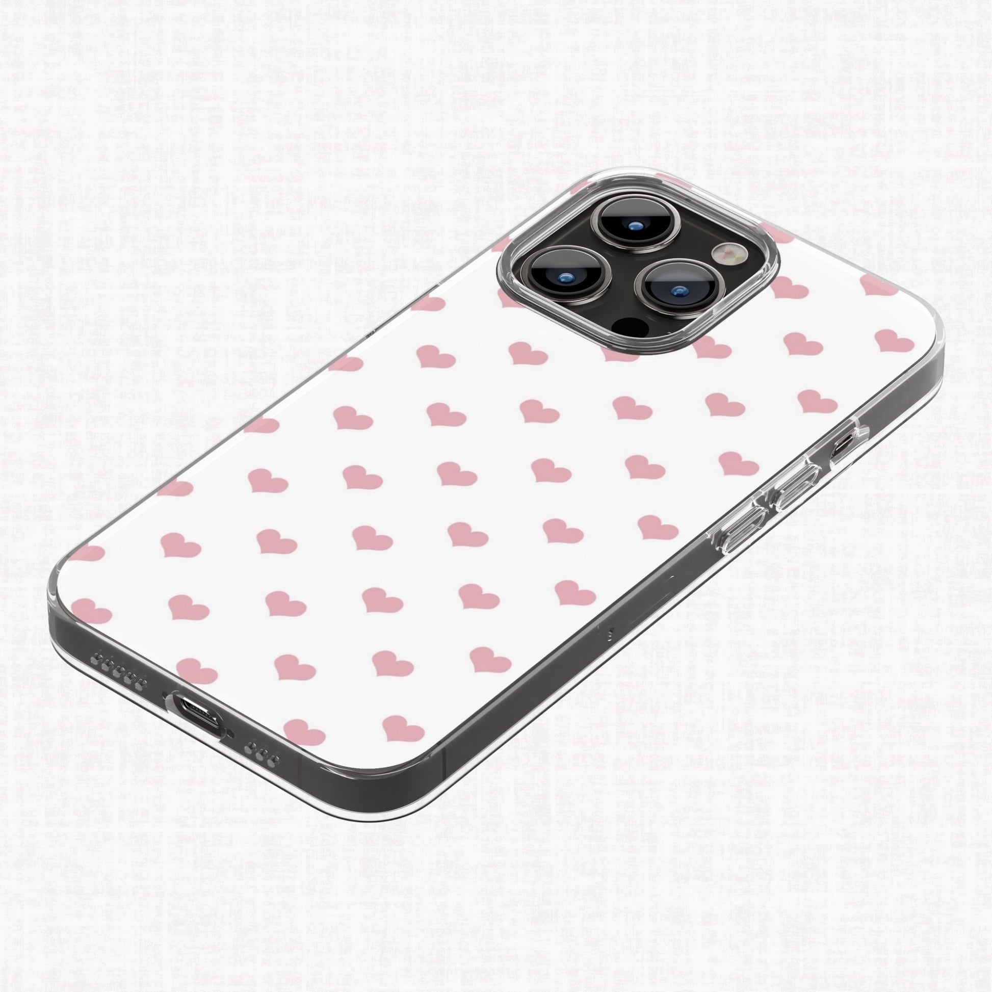 Blush pink heart pattern shown applied to a clear phone case as an example of a finished product design.